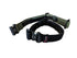 Two dog collars, one black and one green, on a beige surface.